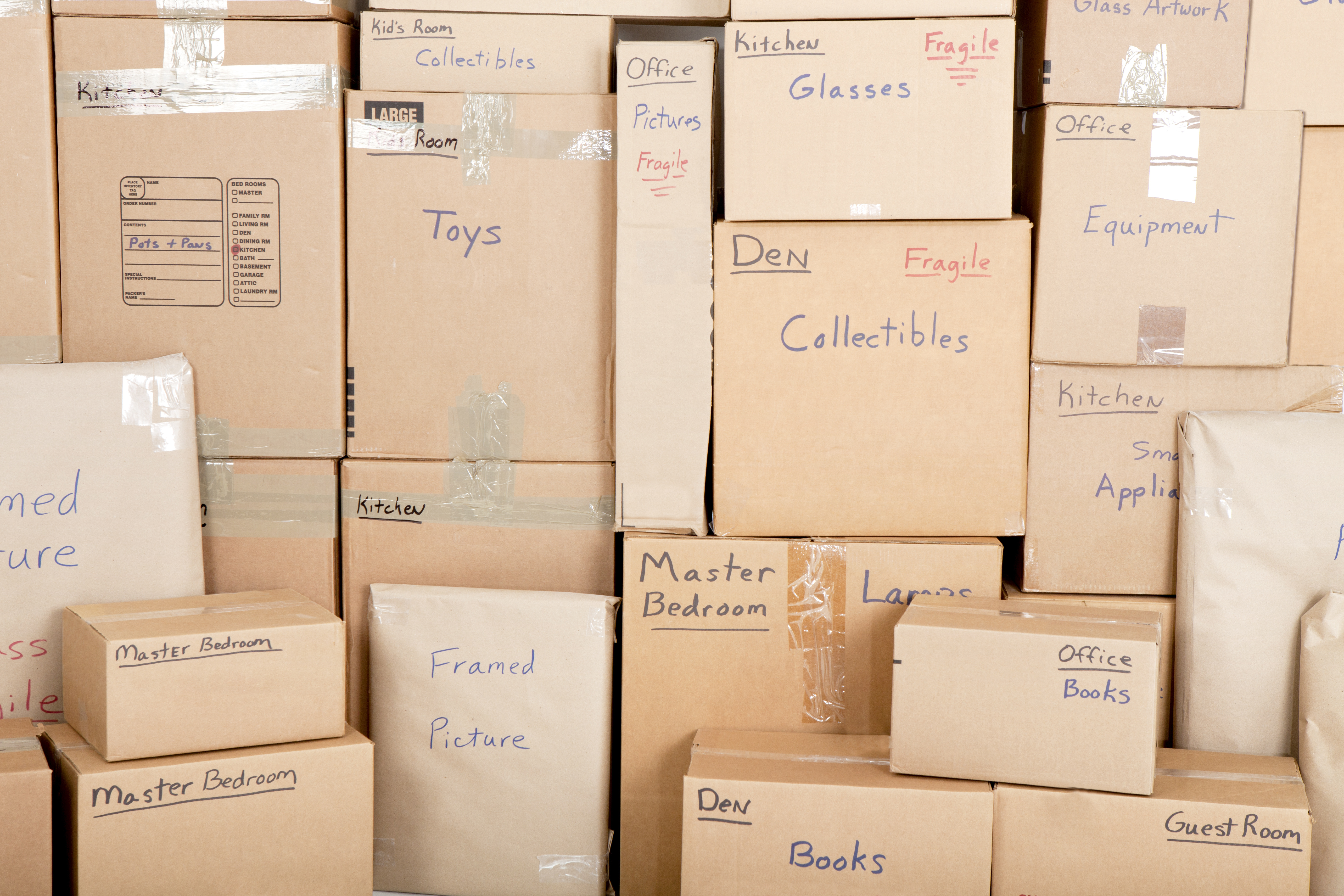 blog image of moving boxes; blog title: Avoid the Stress of Moving With These 5 Tips