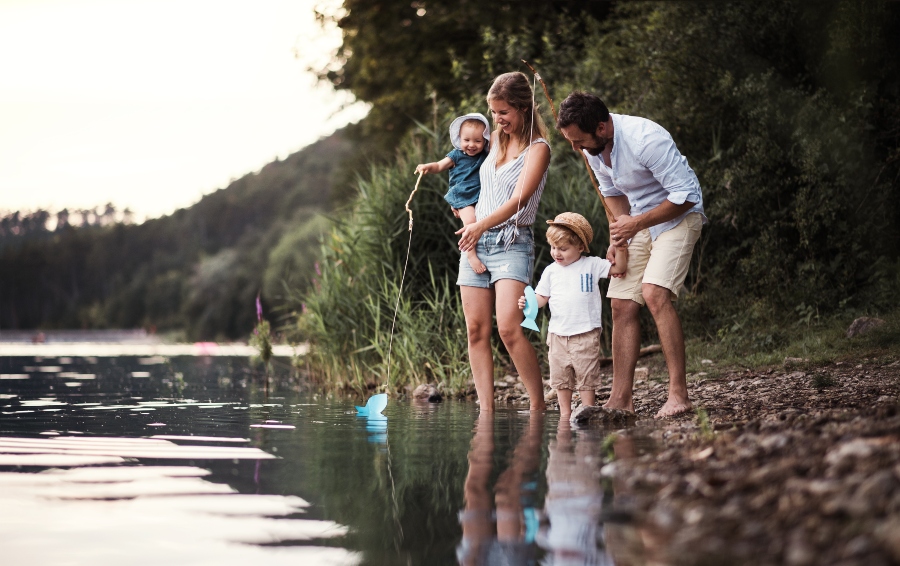 image of a young family at the lake