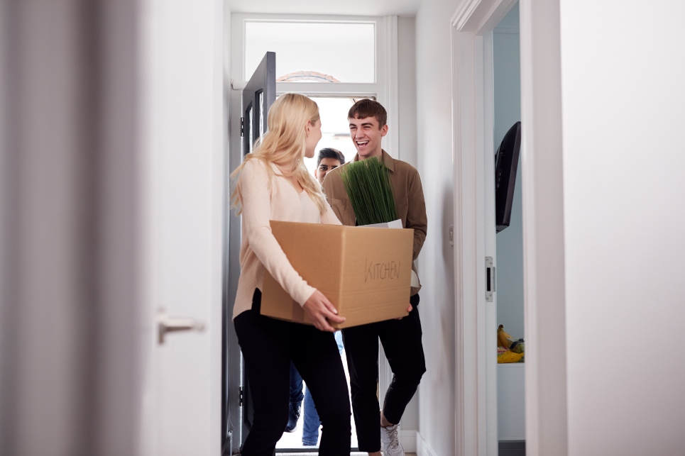 young man and young woman moving into a new apartment